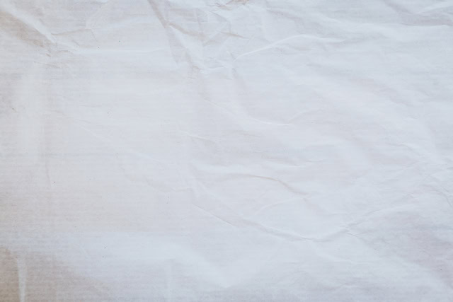Protective drop cloth spread on wooden floor