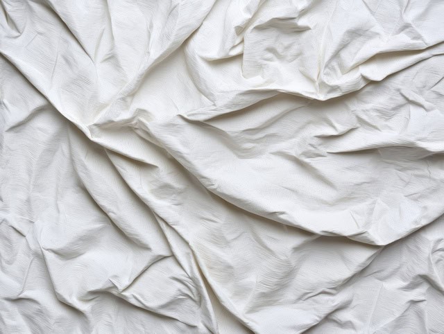 Protective drop cloth spread on wooden floor